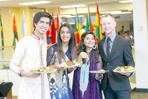 Left to right: Shivantul Singh Chandel, Shaffaq Zaveri, Uzma Ghazanfar and Ian Higgins collect food at last year’s international dinner. The 29th Annual International Dinner “A Window into World Cultures” will be on Saturday, April 9. (Contributed photo)