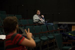 Senior student director Casey Howe (left) talks with senior stage manager Kort Lindblad (right) about a stage direction for the reading of “Morning, Noon & Night.” Lindblad wrote his own senior capstone project and it will be performed Dec. 2-3. (Photo by Taylor Nyman)