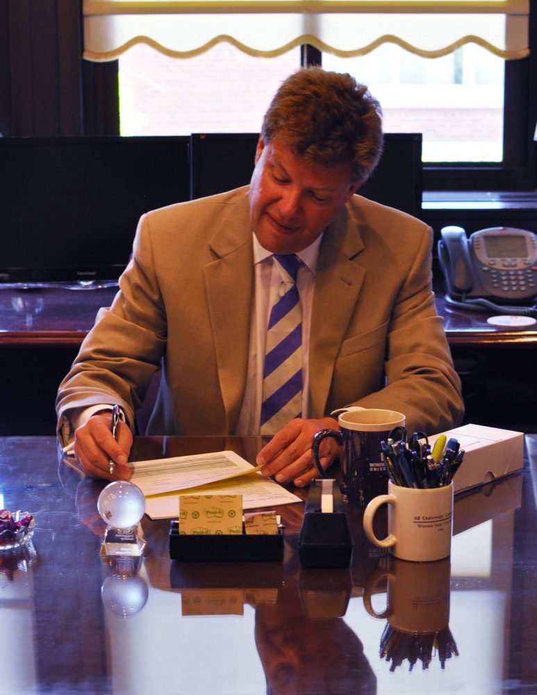 Winona State University president Scott R. Olson sits at his desk on his first day in office.
Matt Shalbrack/Winonan