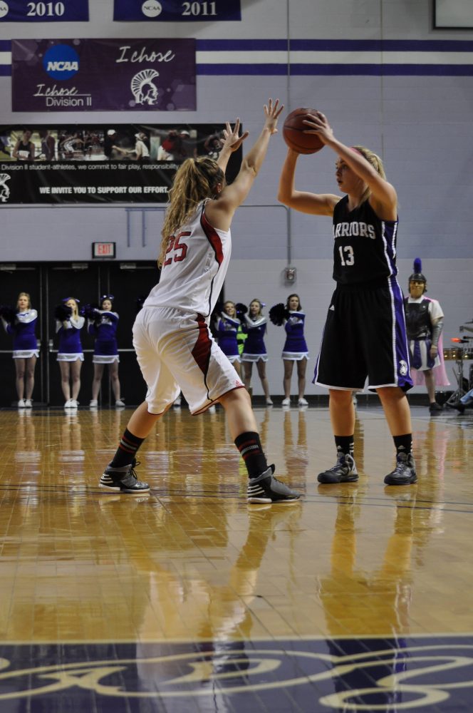 Senior guard Katie Wolff took a look at the court before making a play against Moorhead.
Caitlin Reineke/Winonan
