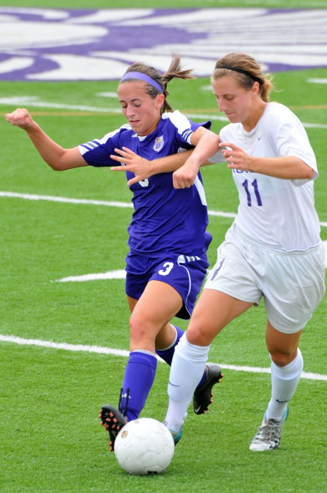 Winona State junior Alaina Kne goes for the steal against Truman State’s Suzanne Pelley on Sept. 8.
ALYSSA GRIFFITH