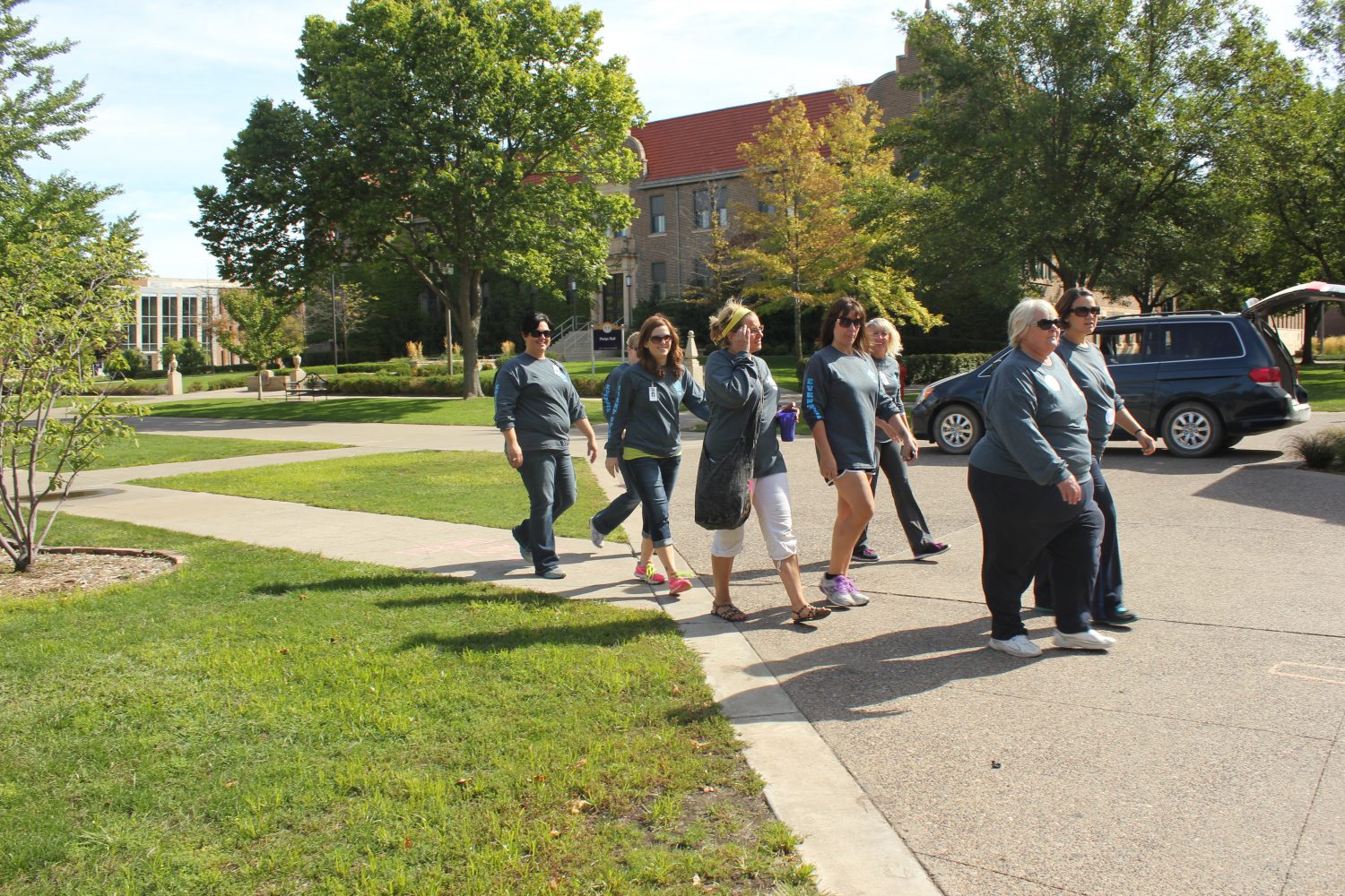 A group of women walk across campus to support Semcac Clinic.   
REAGAN JOHNSON