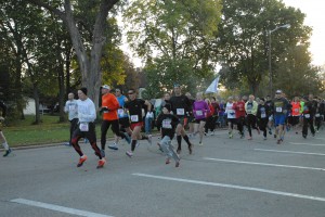 Over 700 runners and walkers stream across the starting line at the Warrior Waddle 5k on Saturday. MARCIA RATLIFF