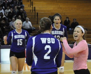 The Warriors celebrate a point against St. Cloud State on Nov. 9. BARTHOLOME RONDET