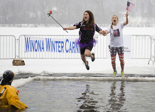 Two jumpers show their American spirit seconds before being submerged in freezing water. 
ANNA BUTLER