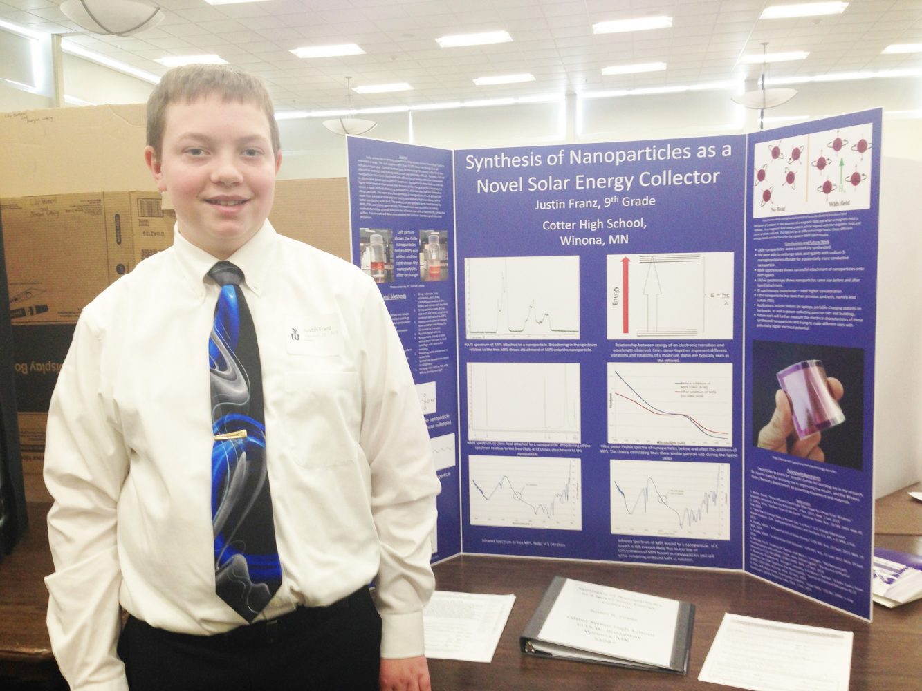 Justin Franz, a 9th grade student from Cotter High School, presents his science project at Winona State University. Photo: Emily Dean