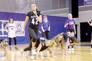 Women’s track and field team perform a “High School Musical” lip sync routine for the “Warriors Got Talent!” event on Monday, Feb. 8. The event raised $1,310.26 for the Make-A-Wish Foundation.  (Photo by Taylor Nyman)