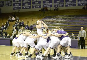 Junior Kayla Timmerman leads the Warriors in a pregame chant before taking the court against St. Cloud State University on Friday, Feb. 5. (Photo by Emma Masuilewicz)
