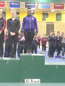 Eboni Jackson (1) stands on the podium as a national champion in the All-Around. Jackson’s score of 38.8 broke the NCGA records. (Photo contributed by Winona State Gymnastics)