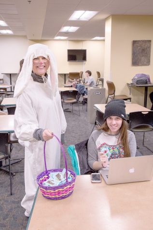 Sophomore Gabby Ingebrand dresses as a bunny and passes out candy in the Smaug Wednesday, March 23 as part of Spring Egg Hunt activities last week. (Photo by Taylor Nyman)