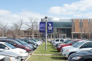 The parking lot at the Integrated Wellness Complex is one of many parking areas on main campus. Around 2,000 parking permits are sold to Winona State students each year. (Photo by Jacob Striker)