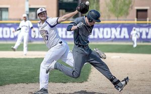 Winona State senior Mitch Voter attempts to get an out on first base during a game against Augustana on Thursday, April 21 at Loughrey Field in Winona. (Photo by Jacob Striker)