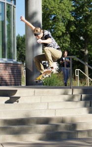 A local of Winona, Harley Sherman, shows off his ollie down the IWC’s front staircase. He said, “There’s never anybody in my way. It’s like a portal from East to West.” (Photo by Brianna Murphy)