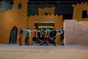 The men’s ensemble rehearses the “Always Look on the Bright Side of Life” dance during a “Spamalot” rehearsal on Thursday in the Vivian Fusillio Main Stage Theatre. The performances will take place Oct. 19-23. (Photo by Taylor Nyman)