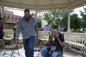 A fellow professor laughs after throwing a pie in English professor Ethan Krase’s face. Money raised from the “Pie in the Face Fundraiser” went towards the Children’s Miracle Network, an organization that has helped the Krase family, as professor Krase’s daughter has Type 1 diabetes.