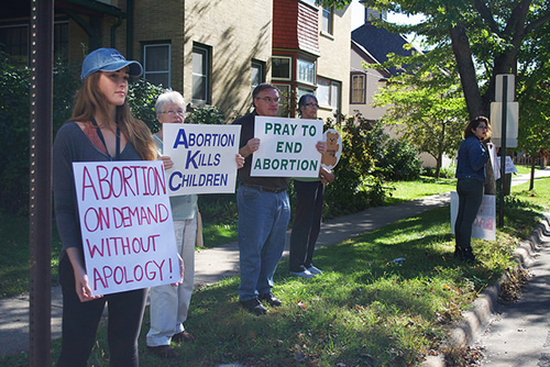 Sarah Ortega, president of Winona State’s FORGE Club protests for pro-choice among pro-life protesters Oct. 2. Other members of FORGE also participated in the counter-protest. (Photos by Brianna Murphy)