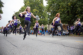 The Winona State dance team performs a routine down Huff Street during the Homecoming Parade on Saturday, Oct. 15.