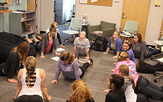 Students participate in “Yoga for Newbies” Tuesday, Oct. 18, an event set up by Winona State’s Health and Wellness advocates.  Participants tried out different poses for beginners in yoga. (Photo by Sara Tiradossi)