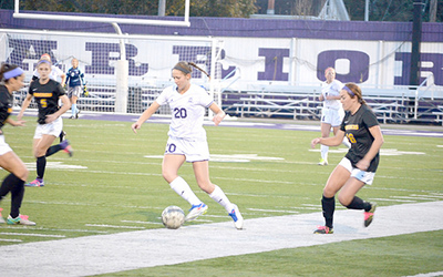 First-year forward Courtney Wiencek readies herself to pass the ball during Friday night’s game against Minnesota State University Mankato at home. Winona State lost 0-3 in the last home game of the season. (Photo by Nicole Girgen)