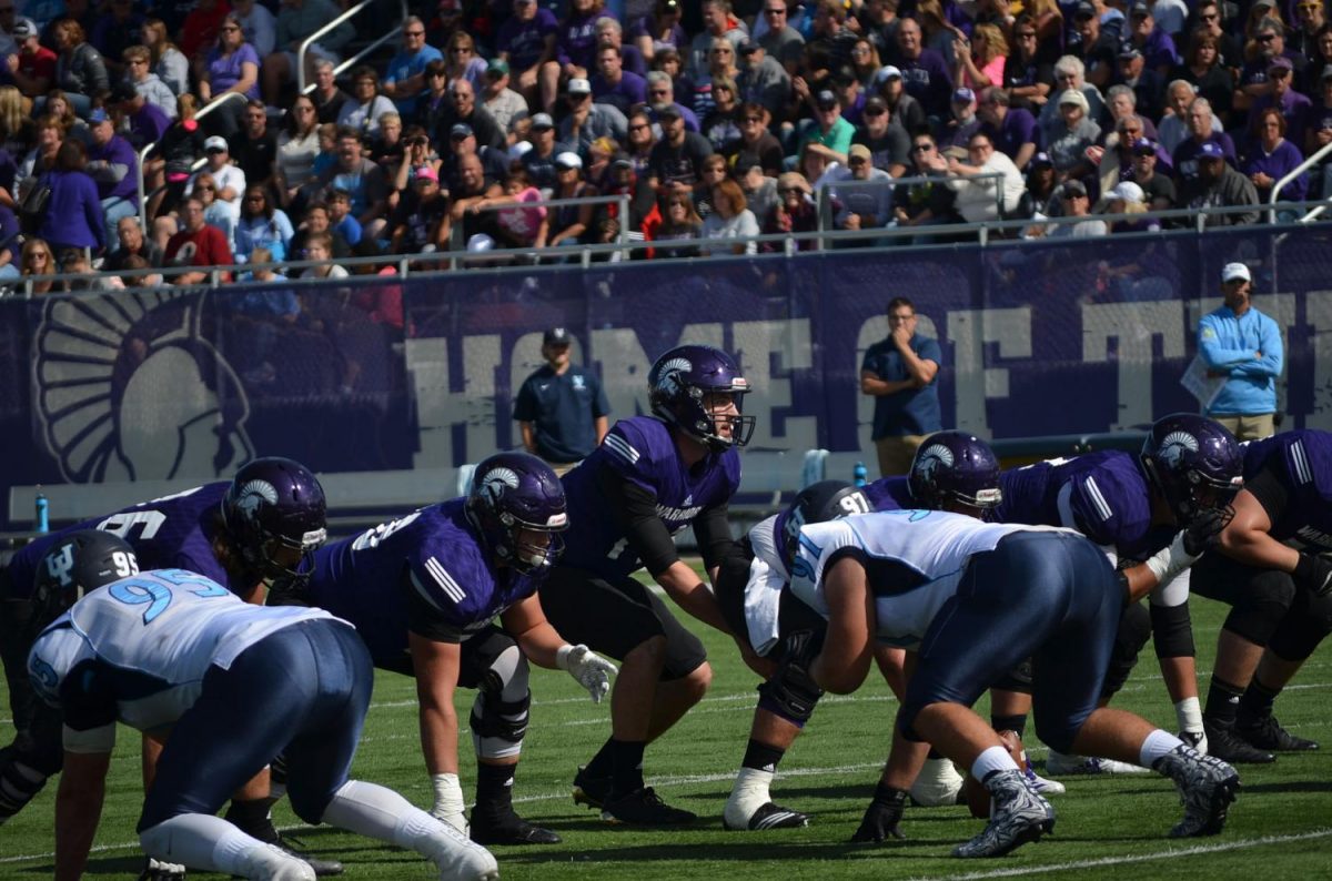 Winona State football players get ready to start a play at their game against Upper Iowa University on Sept. 30. The Warriors swept the game winning 37-7.