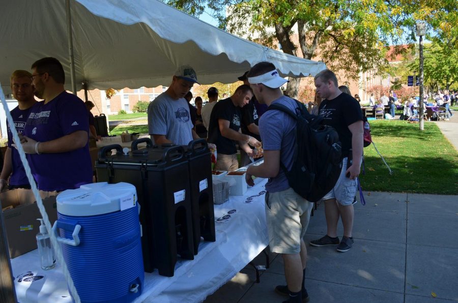 
Members of the Winona State football team hands out walking tacos at the club fair on Friday, October 20 in front of Gildemeister Hall. 