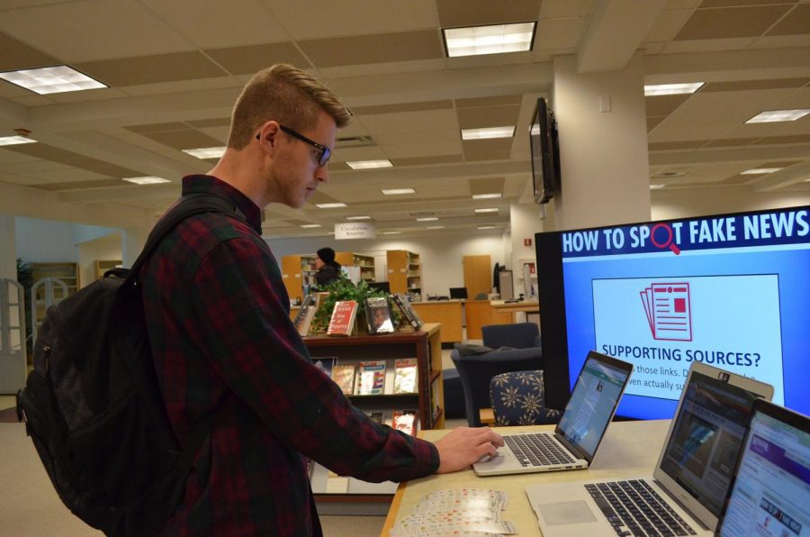 Fifth-year public relations major Sam Wareham participates in a quiz testing his knowledge on how to spot fake news during Tech Tuesday’s “How To Spot Fake News” in the library on Tuesday, Nov. 21. Faculty guided participants navigate which news sites were credible with the help of slide shows and a final quiz.  