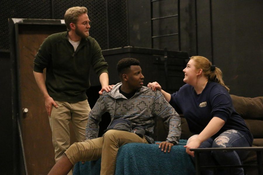From left to right, senior Jake Leif, first-year Ian Loretz and first-year Jessica Campbell rehearse a scene from the theatre and dance department’s upcoming production, “A Dog’s House.”