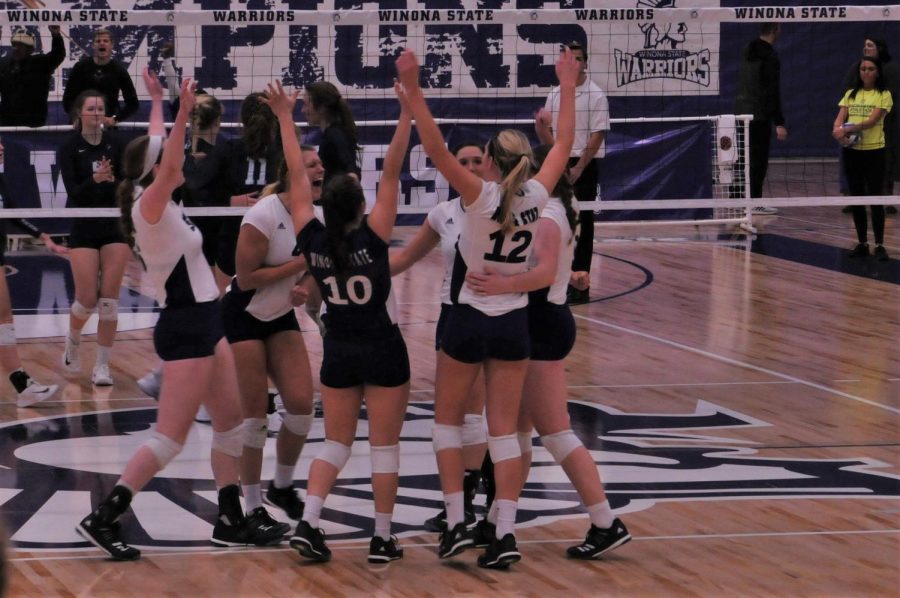 Members of the Women’s Volleyball team celebrate a point scored against Upper Iowa University on Tuesday, Oct. 31 in McCown Gymnasium. The team beat Minot State University 3-0 on Friday, Nov. 3 and the University of Mary 3-0 on Saturday, Nov. 4