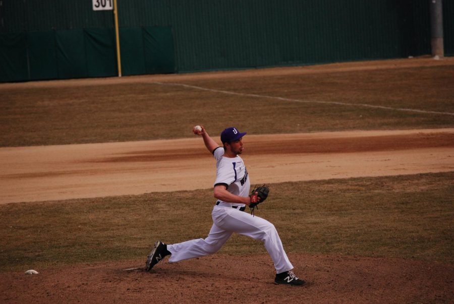 First-year Austin Savary throws a pitch against Upper Iowa University during a doubleheader on Friday, April 12 at Loughrey Field, the Warriors won both games 13-2 and 7-1.