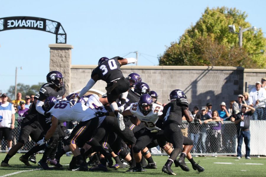 Junior defensive back Romario Gayle hurdles over the line of scrimmage in an attempt to block a field goal on Saturday, September 22 at Altra Credit Federal Union Stadium. Winona State faced off against Minnesota State University - Mankato, loosing 21-31 and tying the team’s overall record at two wins and two losses. 