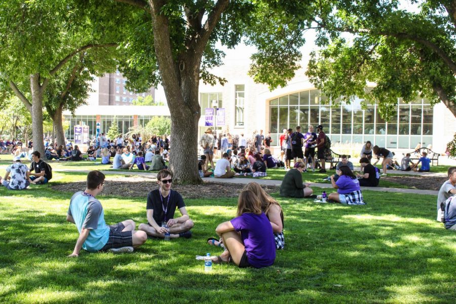 First-year students sit on campus during a picnic event for Welcome week on Tuesday, August 21. New students arrived a week early to accomodate to life at Winona State and learn the campus and area a bit more.