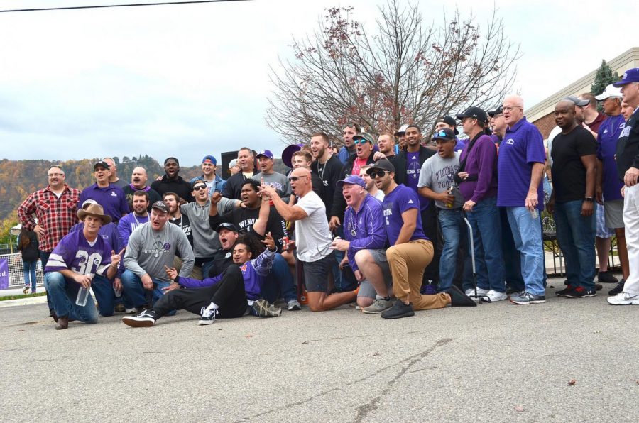 Winona State alumni and former members of the football team gather together for a photo before the 2017 Homecoming game during the Game Day Experience. Events like the Game Day Experience are subject to an exception from the Winona State dry campus policy after some paperwork.