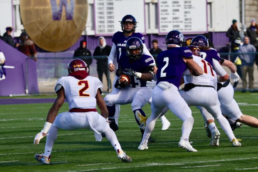 Senior running back Eric Birth attempts to weave around players from the University of Minnesota Duluth on Oct. 20 at Altra Federal Credit Union Stadium, Birth has played for Winona State all four years and chose to remain in his hometown for college. 