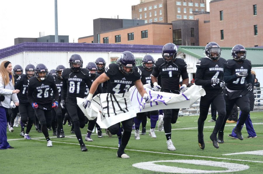 Players charge onto the field, ripping through the banner for the last time this year on Saturday, Nov. 10. This game served as senior day to honor players and cheerleaders on their last game at Winona State. The Warriors took home a 24-20 win against Concordia University, St. Paul bringing the season record to eight wins and three losses. 