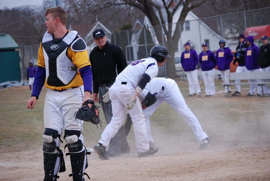 Taylor Field is congratulated by a teammate after completing a full run against Minnesota State University Mankato last season.  