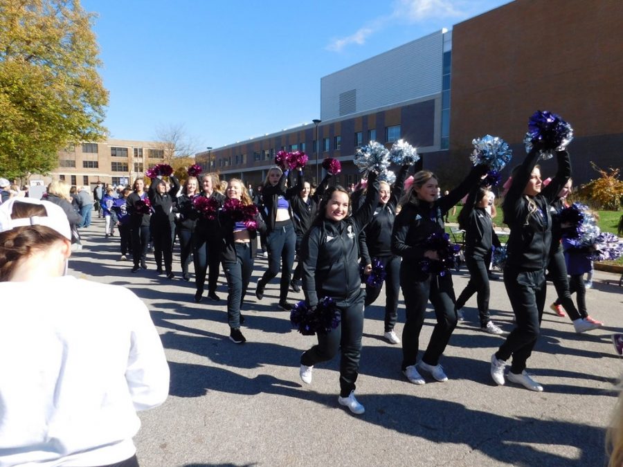 The WSU Dance Team followed behind the football team during the Game Day Experience on Saturday, Oct. 26. Their pep before the game helped push the football team to win against St. Cloud State University.