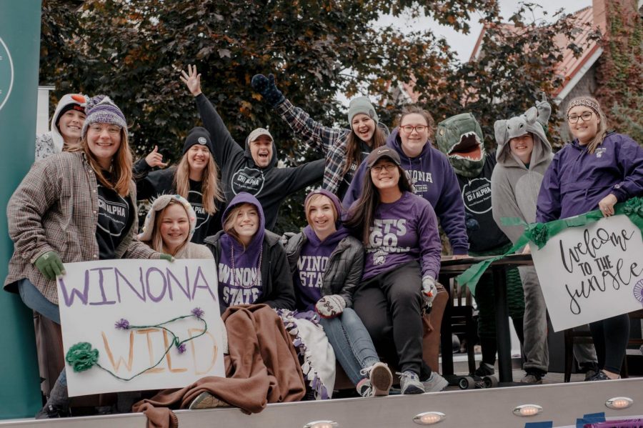Members from Winona’s Chi Alpha ministry shout in excitement on the back of a truck during the 2019 Winona State Homecoming parade. The parade exemplified Winona State’s Homecoming theme, “Wild with Warrior Pride.”