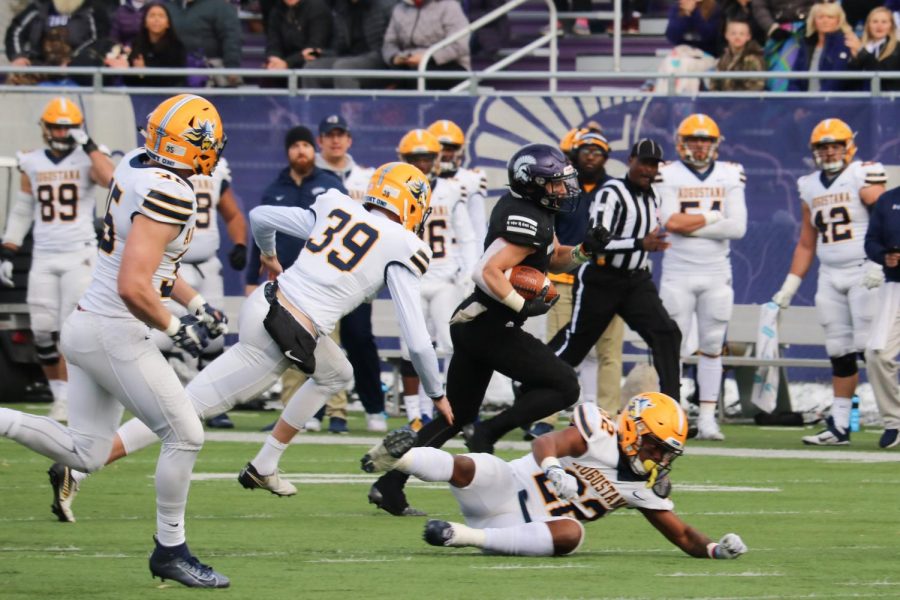 Winona+State+junior+wide+receiver+Jake+Balliu+dodges+Augustana+players+as+he+advances+the+football+down+the+field+at+the+Winona+State+vs.+Augustana+game+on+Saturday%2C+Nov+9.+Despite+their+efforts%2C+the+Warriors+fell+25-26+to+Augustana.