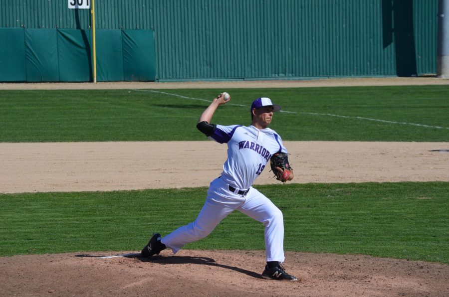 Junior Nathan Looms pitches against the University of Sioux Falls on Friday, April 26 at Loughrey Field. The Warriors played the Cougars in three games over the weekend, coming away with two wins and a loss.
