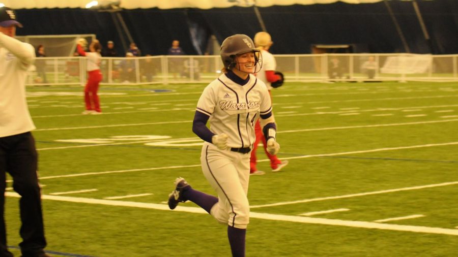 Junior Rylee Stout runs during uring a Feb. 11 game against Grand View University at Rochester Community and Techinical College’s dome. The team would win both of their games against Grand View by scores of 8-0 and 8-4.