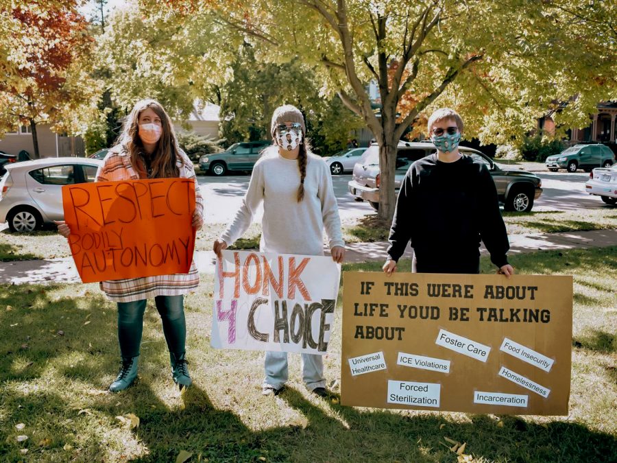 Pro-choice supporters with homemade signs standing in Central Park before the march to Windom Park and near Winona State University’s campus. The march/protest was held on Sunday, Oct. 4.