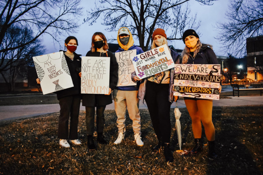 Winona+State+University+club%2C+WSU+Students+for+Reproductive+Justice%2C+coordinated+a+protest+of+the+Warriors+for+Life+event+that+was+held+at+7%3A30+p.m.+on+March+22+outside+of+Kryzsko+Commons.+Roughly+45-50+people+participated+in+the+protest+through+reproductive+justice-inspired+signs%2C+inlcuding+the+students+pictured.+COVID-19+guidelines+were+enforced+by+Reproductive+Justice+club+members.