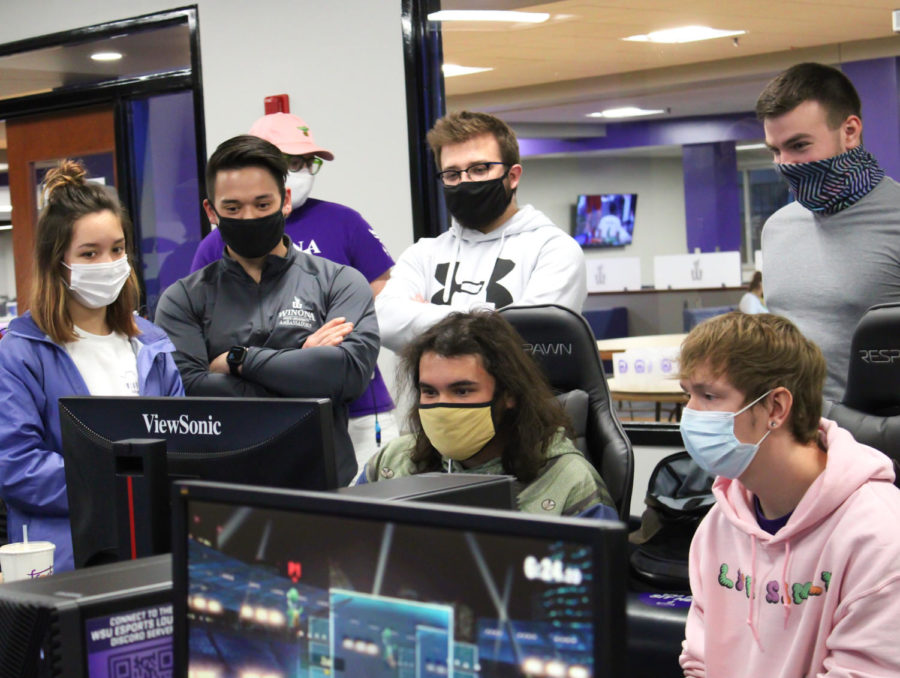 Students participating in the Super Smash Bros. tournament held in the Warrior Esports Lounge from 7-10 p.m. on March 25. From left to right: Samantha Soroos, Jarred Schmitz, Luke Torian and two more students. 