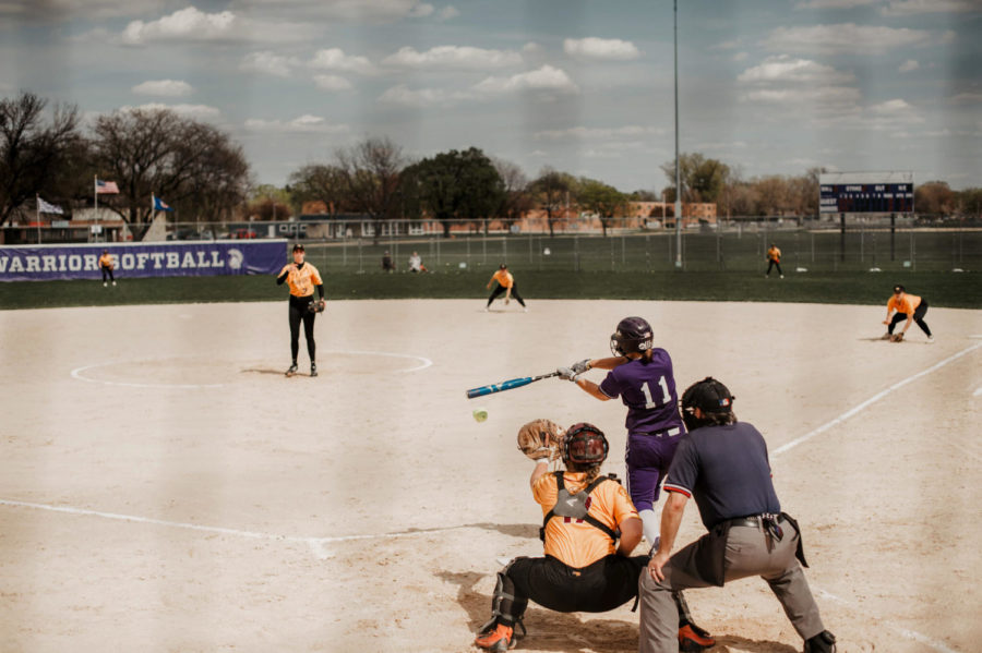 Photo of fifth-year catcher Alison Nowak swinging for the Winona State women’s softball team during the games against University of Minnesota-Crookston.