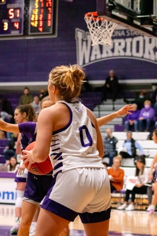 Warrior Caitlin Riley looking to pass the ball past Sioux Falls' defense. The two teams traded leads in the opening ten minutes of play, with Winona State battling back from a 15-9 deficit to close the gap to 16-15, down just one heading into the second quarter.