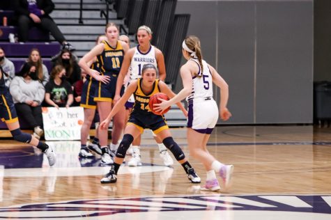 (Leftside photo) First-year War- riors guard, Mattie Schimenz, being blocked by Concordia St- Paul’s Jadyn Hanson during the game on Feb. 17, 2022 where the Warriors fell 50-47 in a tight match up. Schimenz played last year as well, shooting a 41.3% from the field and a 26% from deep for a total of 64 points across 11 games for the season.