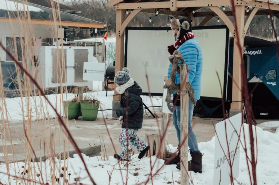 People of all ages volunteered at the fes- tival, some doing tasks like tending the ongoing bonfires, helping attendees with snowshoeing and setting up concessions.