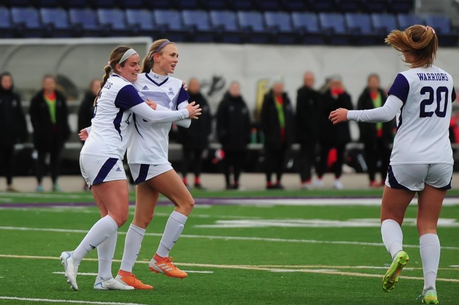 Riley Harmon and Jadia Wiege celebrating. Both Harmon and Wiege shared a goal each in Winona State’s 3-0 win over Minnesota State University - Moorhead on Oct. 14.