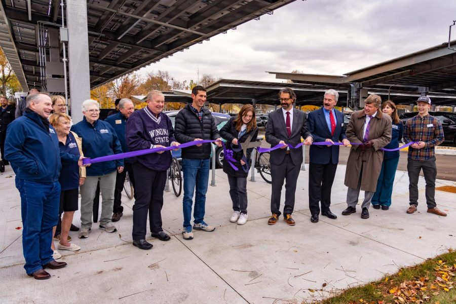 On+Tuesday+Oct.+25+a+ceremonial+ribbon-cutting+event+was+held+to+commemorate+the+completion+of+the+Leading+Energy+Savings+and+Sustainability+%28LESS%29+project.+This+project+makes+Winona+State+University+a+leader+of+sustainability+in+Minnesota.+The+LESS+project+cuts+carbon+emissions+down+by+25+percent+each+year.+WSU+Student+Senate+President+Malorie+Olson+is+shown+cutting+the+ribbon.