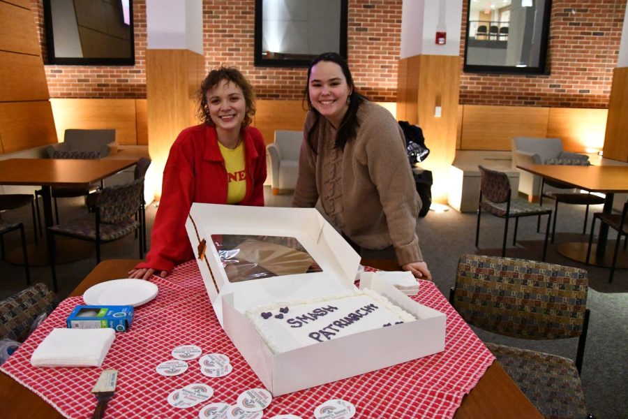 Cassidy Vogel (left) and Jessica Weis (right) representing the Reproductive Justice Club of WSU as treasurer and president respectively. Along with a film screening, the event provided cake and free books about women, intersexuality, and racism.
